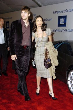 Ashton Kutcher, Demi Moore (wearing Roland Mouret) at arrivals for 4th annual GM TENT EVENT, Hollywood, Los Angeles, CA, February 22, 2005. Photo by: Michael Germana/Everett Collection clipart