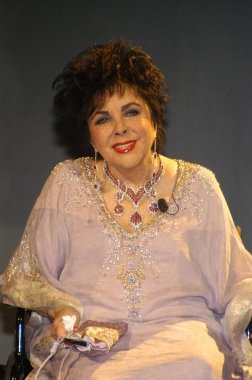 Dame Elizabeth Taylor on stage for Macy''s Passport Gala 2006 Show and Benefit, Santa Monica Aiport''s Barker Hanger, Santa Monica, CA, September 28, 2006. Photo by: Tony Gonzalez/Everett Collection clipart