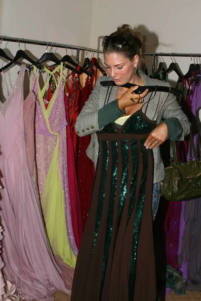Daisy Fuentes inside tries on dresses for Mario Badescu pre-Oscar celebrity gift lounge, Regent Beverly Wilshire Hotel, Los Angeles, CA, Saturday, February 26, 2005. Photo by: Effie Naddel/Everett Collection