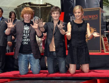 Rupert Grint, Daniel Radcliffe, Emma Watson at the induction ceremony for Harry Potter Foot-Print and Wand-Print Ceremony, Grauman''s Chinese Theatre, Los Angeles, CA, July 09, 2007. Photo by: Dee Cercone/Everett Collection