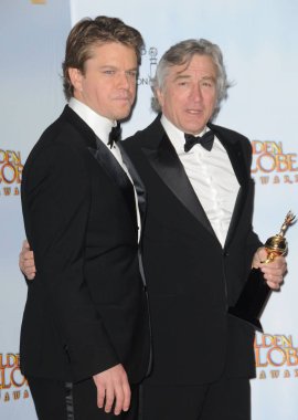 Matt Damon and Robert De Niro in the press room for The Hollywood Foreign Press Association 68th Annual Golden Globes Awards - PRESS ROOM, Beverly Hilton Hotel, Los Angeles, CA January 16, 2011. Photo By: Dee Cercone/Everett Collection