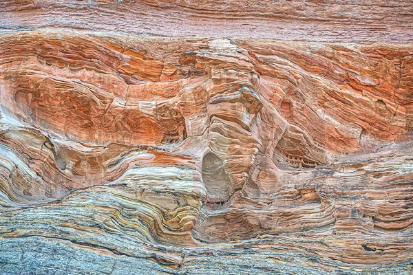 砂岩是一种碎屑岩沉积岩 主要由砂大小的硅酸盐颗粒组成 大多数砂岩是由石英或长石组成的 因为它们是耐久性最强的矿物 图库图片