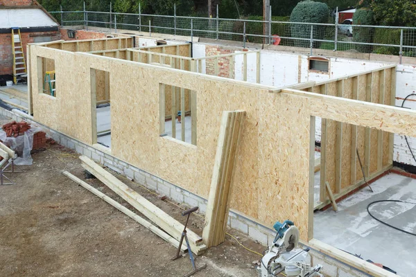 Timber frame house extension or annexe under construction in the UK