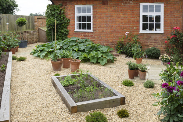 Garden with oak sleeper raised bed