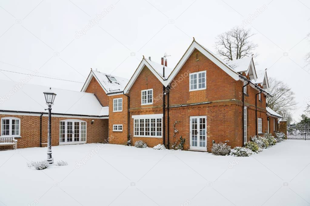 Country house in winter snow