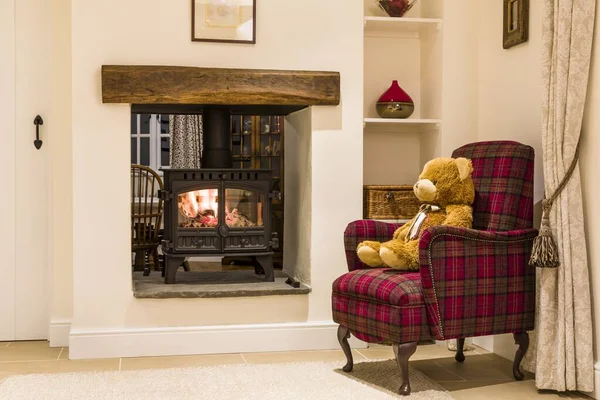 Cosy fireplace with wood burning stove — Stock Photo, Image