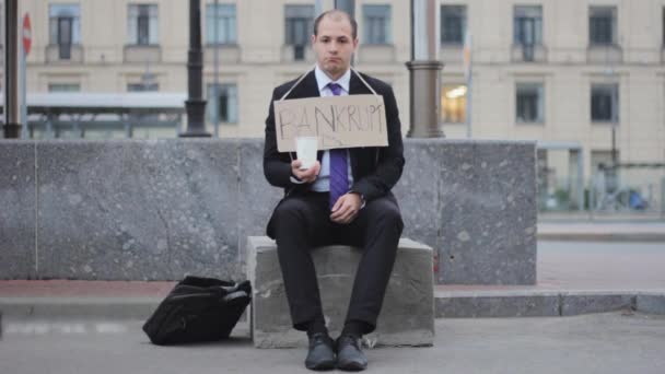 Businessman Sits Asking Help Money — Stock Video