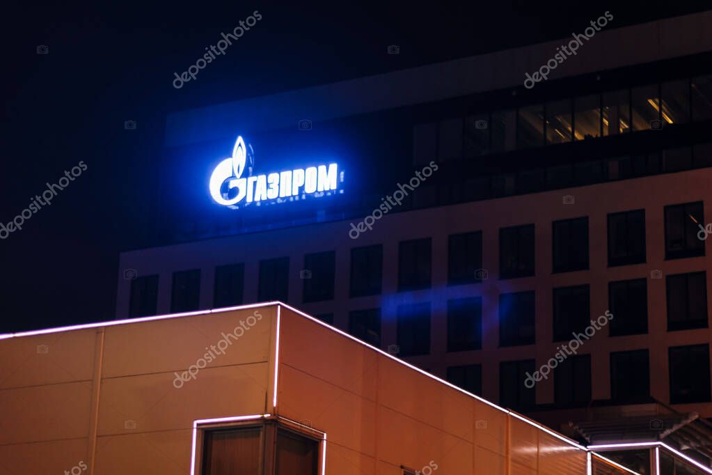 Gazprom building with logo glows at night saint petersburg company
