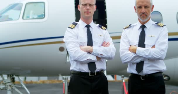 Portrait Two Male Pilots Standing Arms Crossed Runway — Stock Video