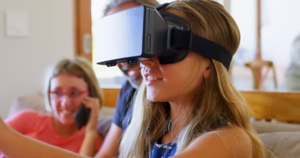 Father Looking Daughter Using Virtual Reality Headset Home — Stock Video