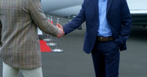 Businessmen Shaking Hands Each Other Runway — Stock Video