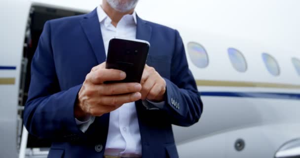 Mid Section Businessman Using Mobile Phone Runway — Stock Video