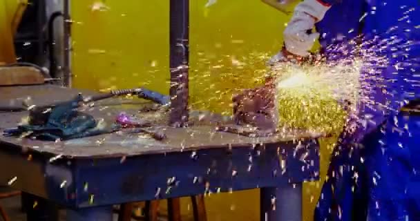Male Engineer Using Grinder Machine Workshop — Stock Video