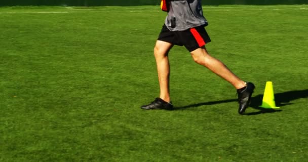 Football Player Practicing Field Sunny Day — Stock Video