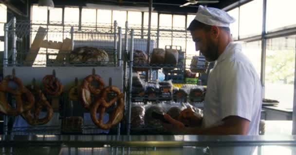 Male Chef Maintaining Records Commercial Bakery Shop — Stock Video