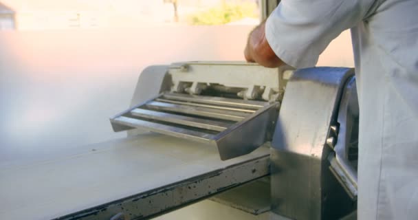 Male Chef Using Dough Sheeter Machine Kitchen — Stock Video