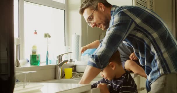 Father Siblings Cleaning Kitchen Sink Home — Stock Video