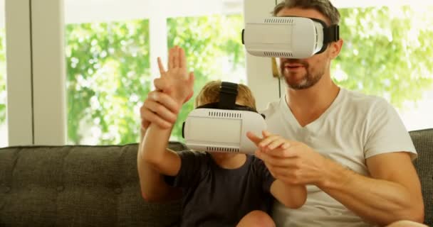 Father Son Using Virtual Reality Headsets Sofa Home — Stock Video