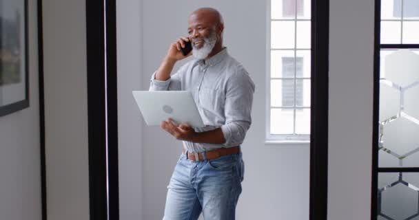 Businessman Talking Mobile Phone While Using Laptop Office — Stock Video