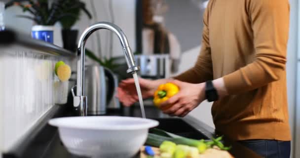 Man Washing Capsicum Water Tap Kitchen — Stock Video