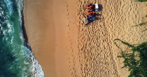 Aerial view of tourists sitting together at beach 4k — Stock Footage Aerial View Tourists Sitting Together Beach Royalty Free Stock Video