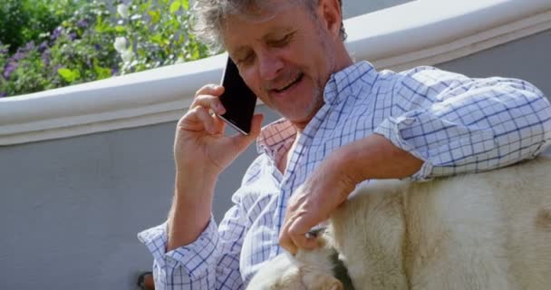 Senior Man Talking Mobile Phone While Using Laptop Porch Steps — Stock Video