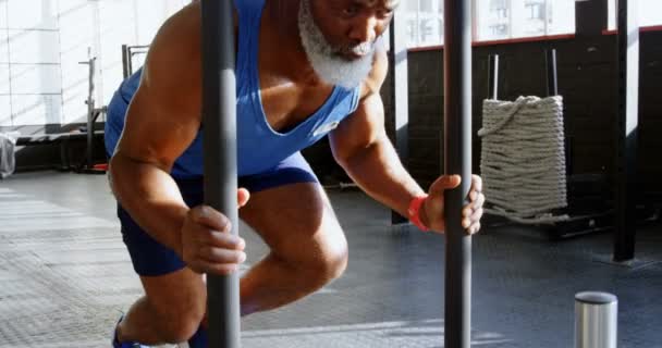 Determined Senior Man Pushing Weight Sled Fitness Studio — Stock Video