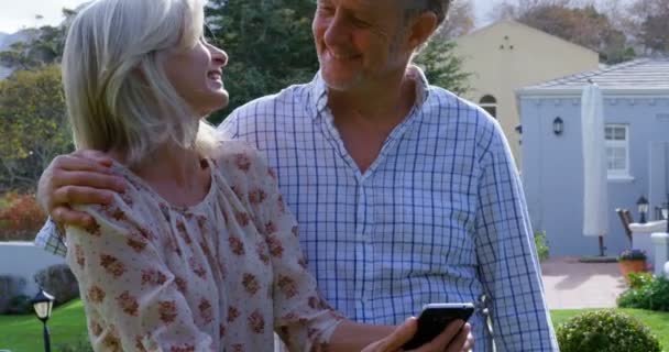 Happy Senior Couple Using Mobile Phone Porch — Stock Video