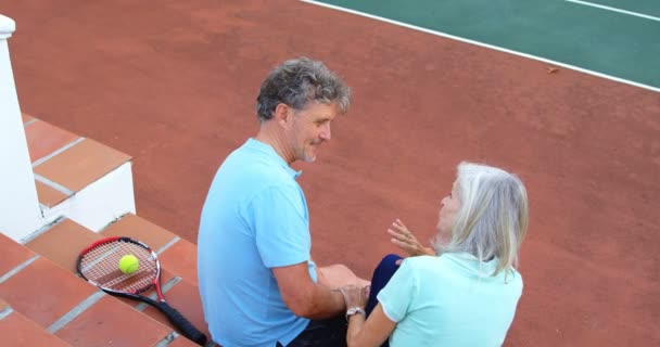 Rear View Senior Couple Sitting Tennis Court Stairs — Stock Video