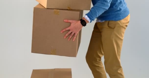 Courier Man Picking Cardboard Boxes White Background — Stock Video © Wavebreakmedia_Video #211116362