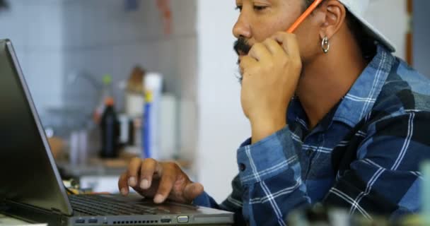 Attentive Man Working Laptop Workshop — Stock Video