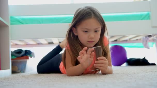 Girl Using Glass Mobile Phone Floor Home — Stock Video