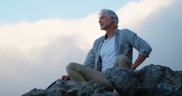 Active Senior Man Relaxing Rock Countryside — Stock Video