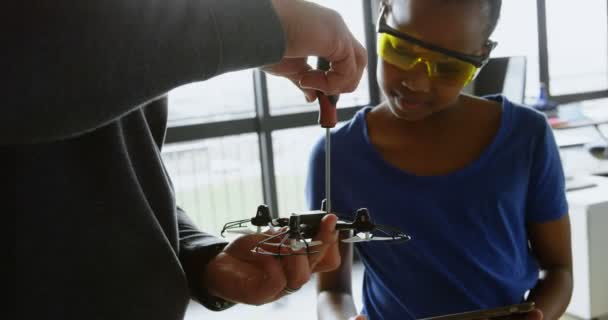 Father Daughter Repairing Drone Office — Stock Video