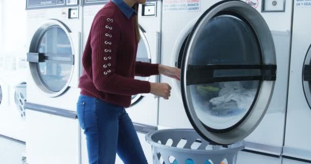 Woman Removing Clothes Washing Machine Laundromat — Stock Video