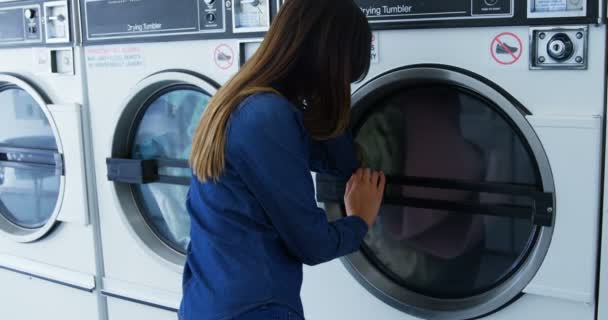 Woman Looking Washing Machine Laundromat — Stock Video