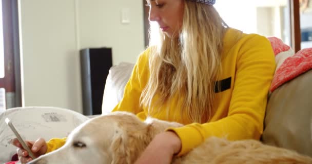 Woman Sitting Sofa Her Dog Using Mobile Phone Home — Stock Video