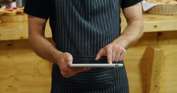 Portrait Male Waiter Using Digital Tablet Cafe — Stock Video