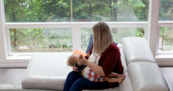 Mother Consoling Her Baby Boy Living Room Home — Stock Video
