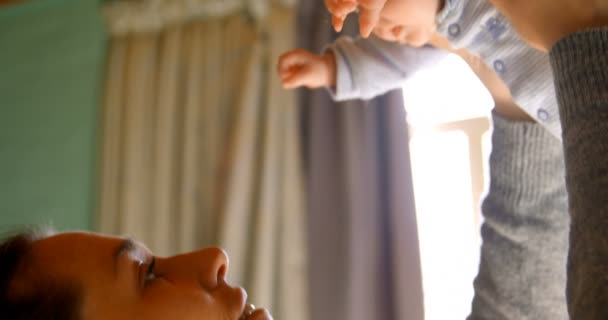 Close Mother Holding Her Baby Boy Home — Stock Video