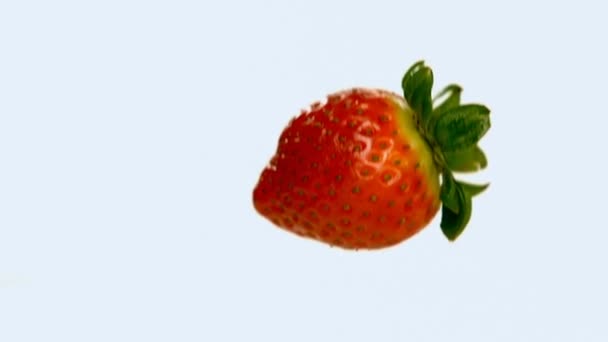 Close Strawberry Falling Milk White Background — Stock Video