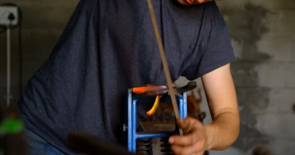 Close Attentive Focused Female Metalsmith Shaping Glowing Hot Horseshoe Factory — Stock Video