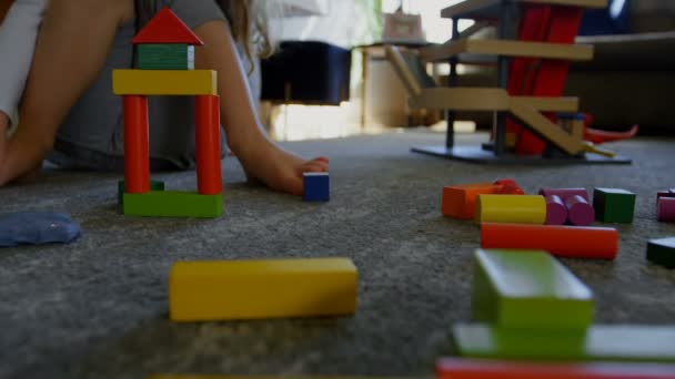 Cute Little Girl Playing Building Blocks Floor Living Room Home — Stock Video