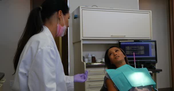 Side View Female Dentist Wearing White Lab Coat Interacting Female — Stock Video