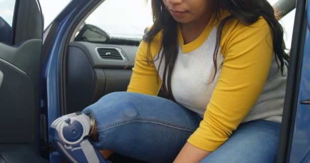 Beautiful Disabled Woman Tying Shoe Lace Car Woman Sitting Car — Stock Video