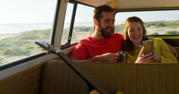 Happy Couple Using Mobile Phone Van Couple Spending Time Together — Stock Video