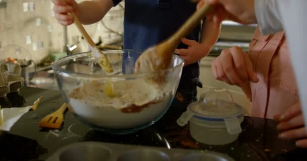 Cute Siblings Mixing Dough Bowl Kitchen Mother Teaching Kids Bake — Stock Video