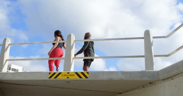 Couple Walking Hand Hand Railing Sunny Day Beautiful Sky Clouds — Stock Video