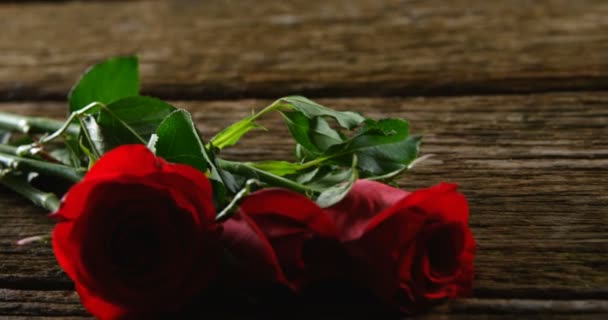 Three Red Roses Wooden Surface Valentines Day Concept — Stock Video