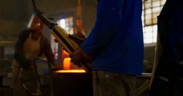 Male Worker Operating Overhead Crane Machine Workshop Molted Metal Container — Stock Video